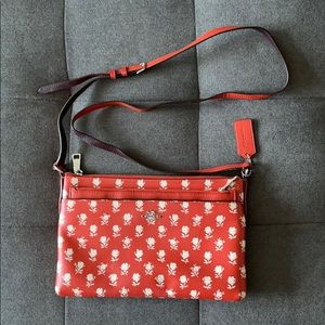 Coach red crossbody bag w/ white rose print